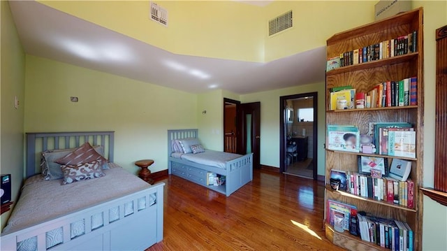 bedroom with wood-type flooring