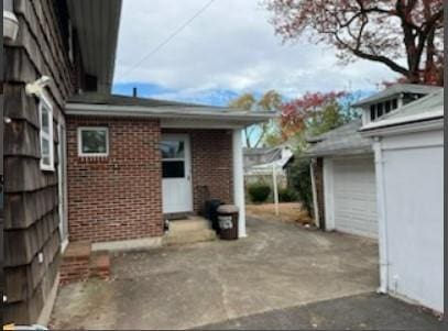 view of patio / terrace featuring a garage