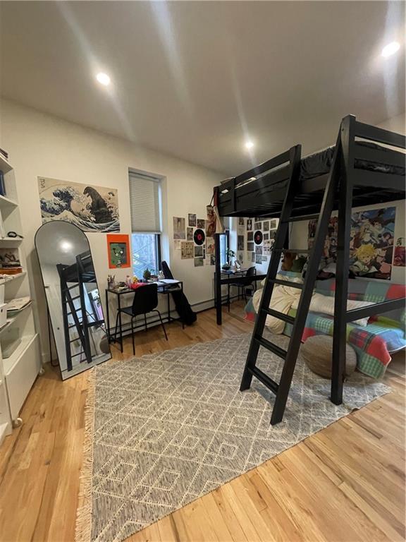 bedroom with wood-type flooring