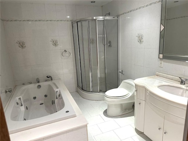 full bathroom with tile walls, tile patterned flooring, vanity, shower with separate bathtub, and toilet