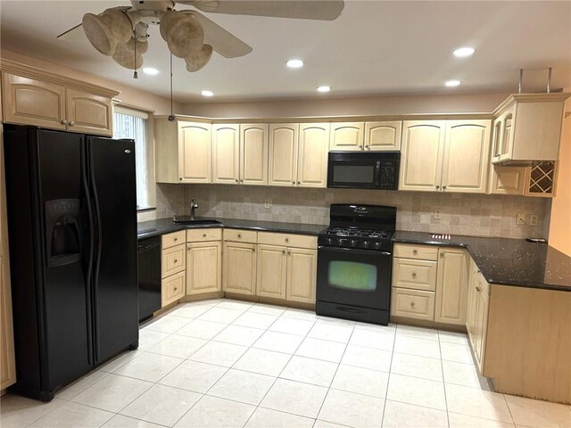 kitchen with light tile patterned floors, ceiling fan, backsplash, black appliances, and light brown cabinetry