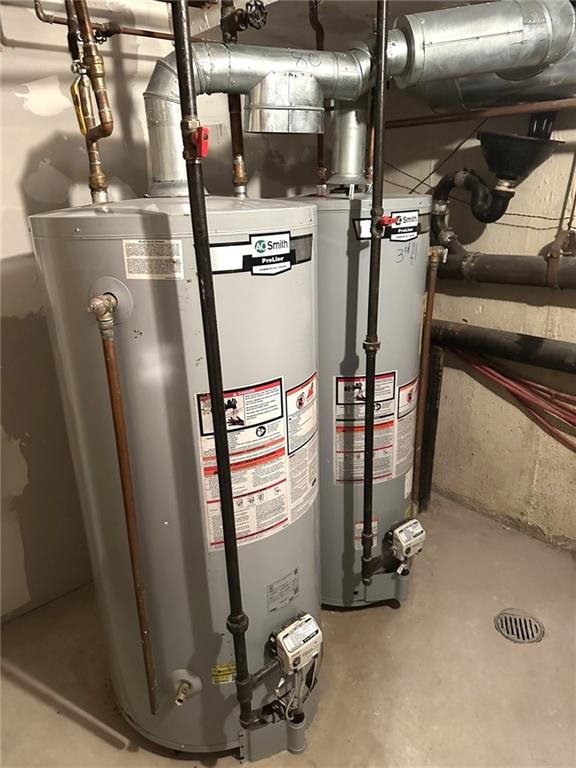 utility room featuring gas water heater