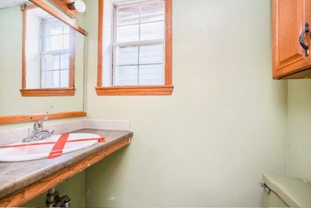 bathroom featuring sink and toilet