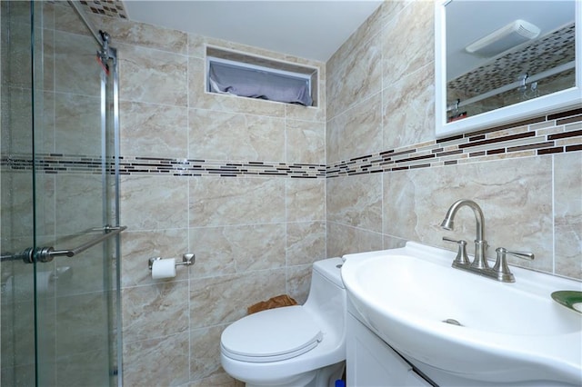 bathroom with decorative backsplash, vanity, tile walls, and toilet