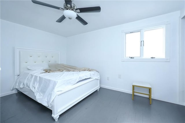 bedroom with ceiling fan and dark hardwood / wood-style floors