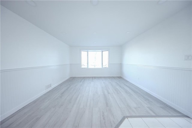 spare room with light wood-type flooring