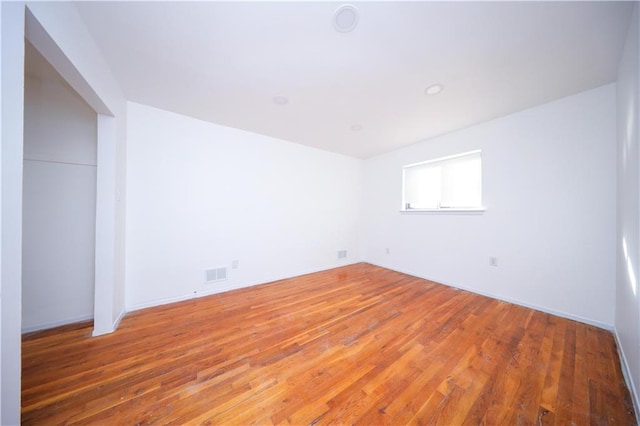 empty room featuring hardwood / wood-style floors