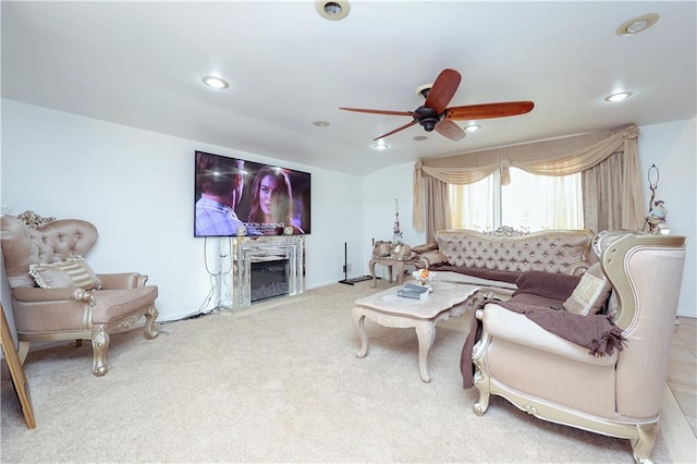 living room featuring carpet floors and ceiling fan