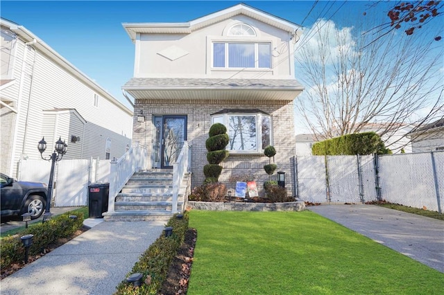 front facade with a front yard