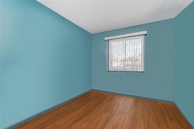 empty room featuring hardwood / wood-style flooring