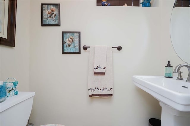 bathroom with toilet and sink