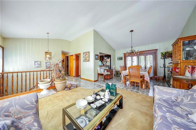 carpeted living room featuring vaulted ceiling and a notable chandelier