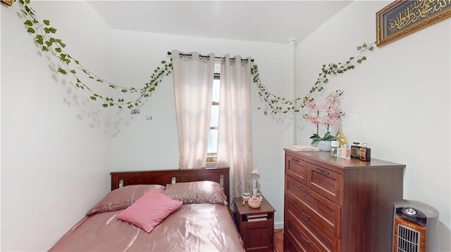 bedroom featuring heating unit