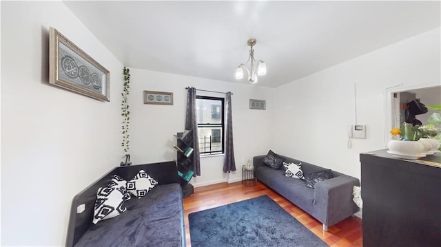 living room featuring hardwood / wood-style floors and a notable chandelier