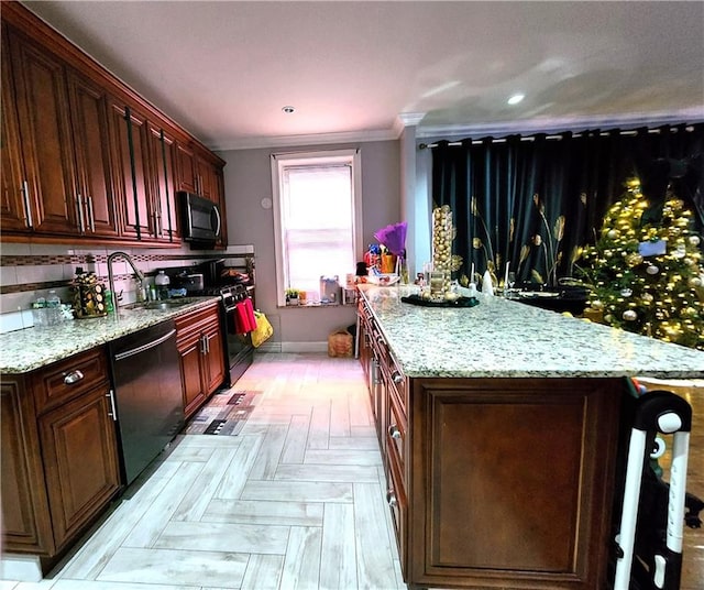 kitchen with dishwasher, range with gas cooktop, ornamental molding, a center island, and light stone countertops