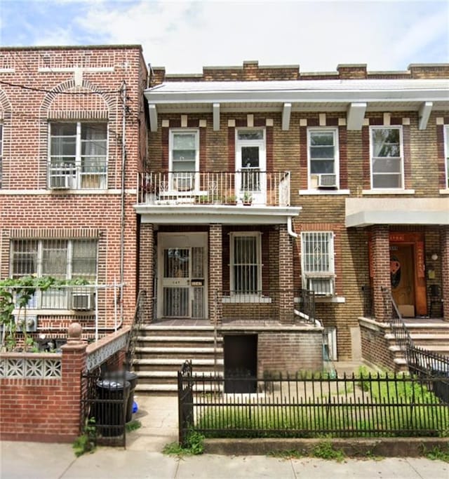 view of property with a balcony