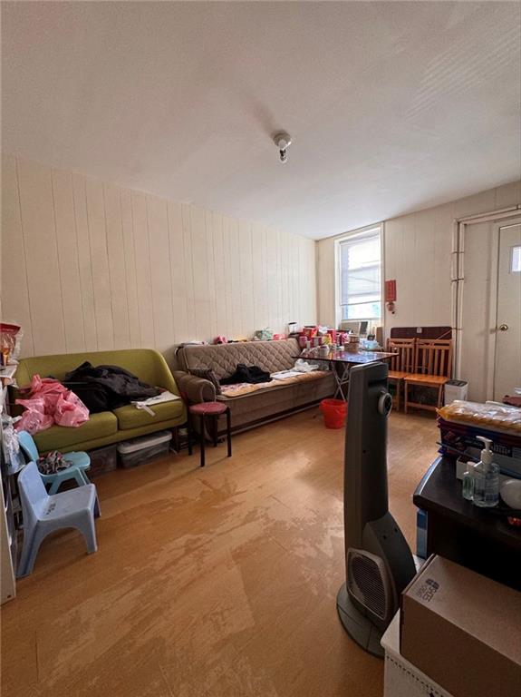 living room featuring wooden walls