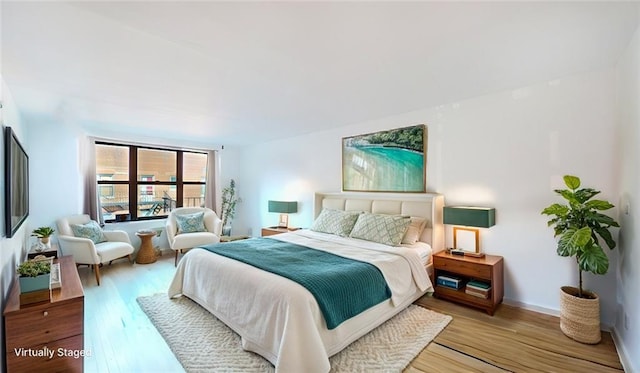 bedroom with light wood-style flooring