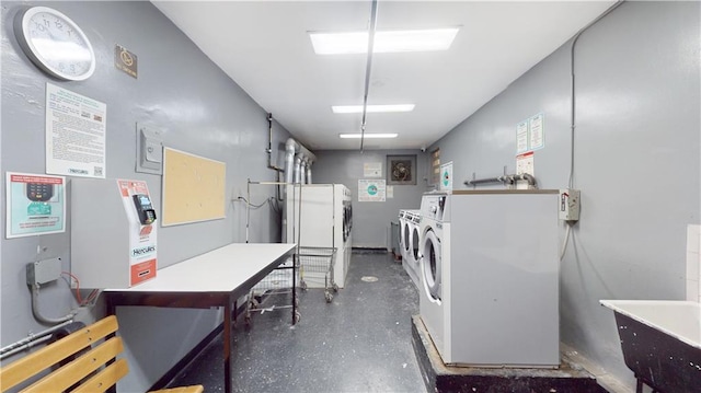 community laundry room featuring separate washer and dryer