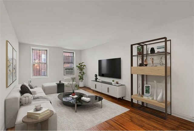 243 Mcdonald Ave Unit 1D, Brooklyn, NY 11218 - living area featuring wood finished floors, cooling unit, and baseboards