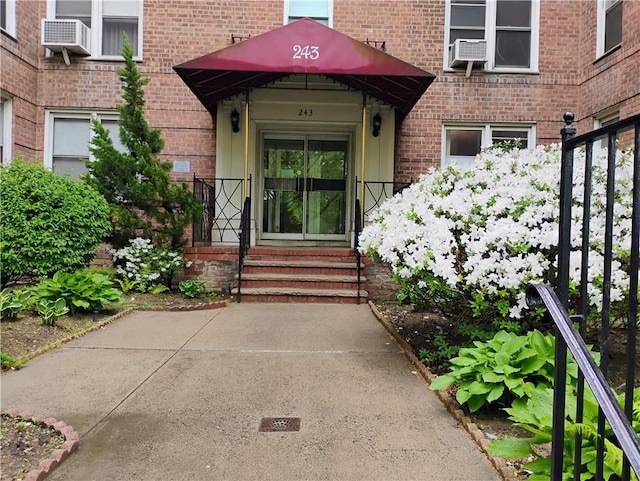 243 Mcdonald Ave Unit 1D, Brooklyn, NY 11218 - property entrance with brick siding and cooling unit