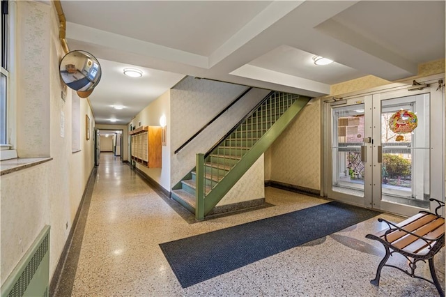 community lobby with visible vents and stairs