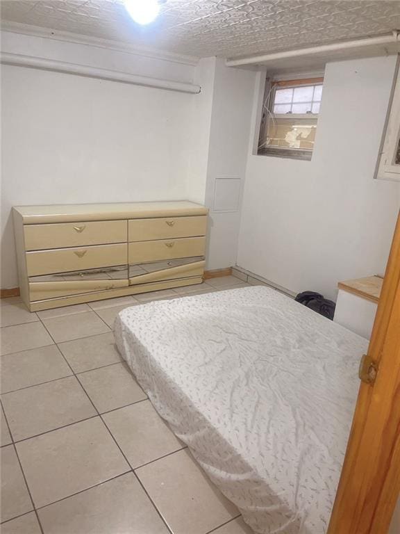 bedroom featuring light tile patterned floors