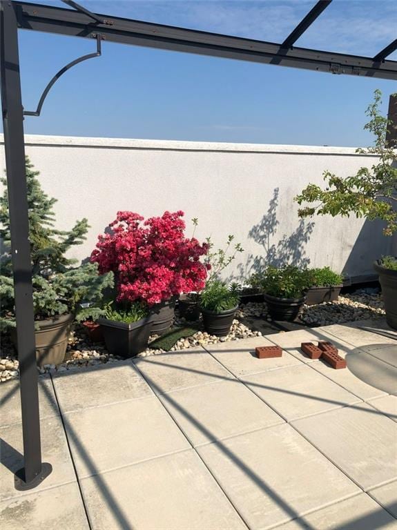 view of patio / terrace featuring a lanai