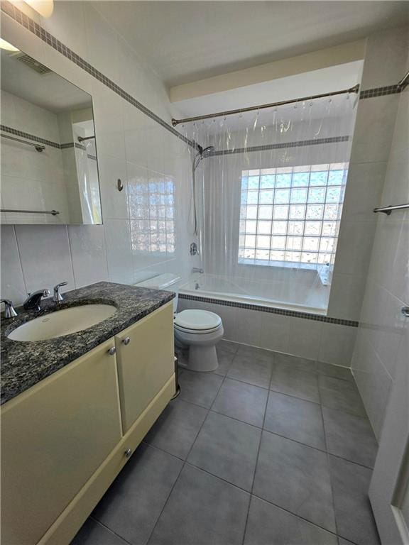 1927 78th St Unit 4A, Brooklyn, NY 11214 - full bathroom featuring tiled shower / bath, vanity, tile patterned floors, and tile walls