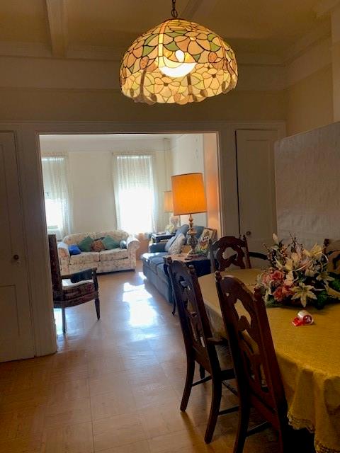 dining room with beam ceiling