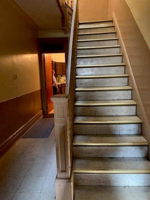 stairs with wood walls