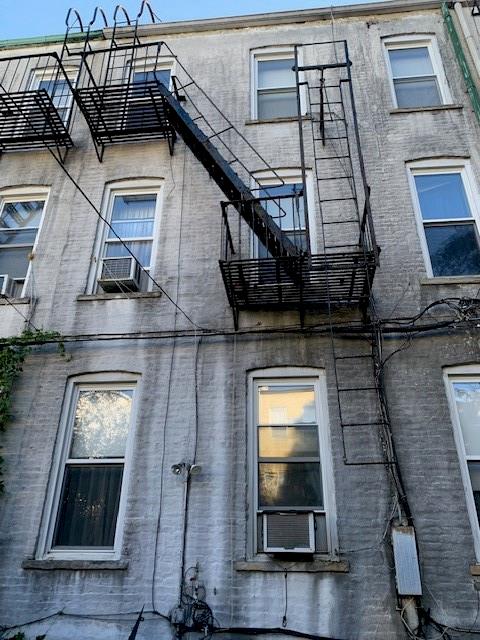 view of home's exterior with cooling unit