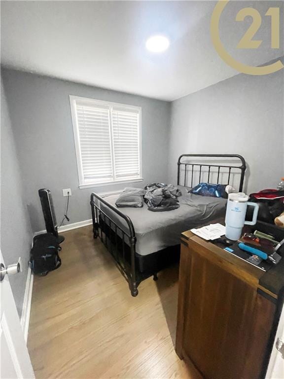 bedroom with light hardwood / wood-style flooring