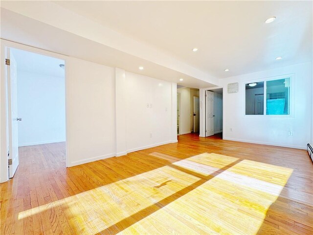 unfurnished room with light wood-type flooring