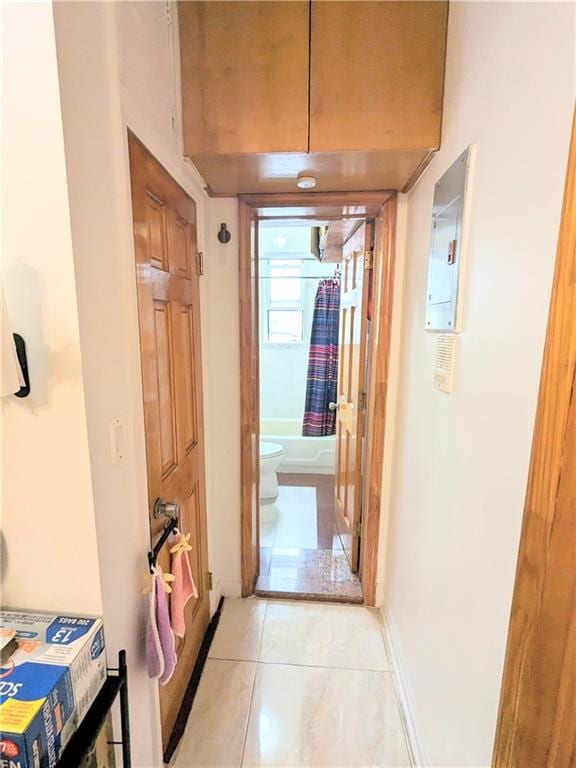 hallway featuring light tile patterned flooring