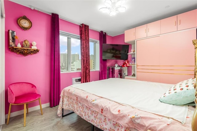 bedroom with light wood-type flooring