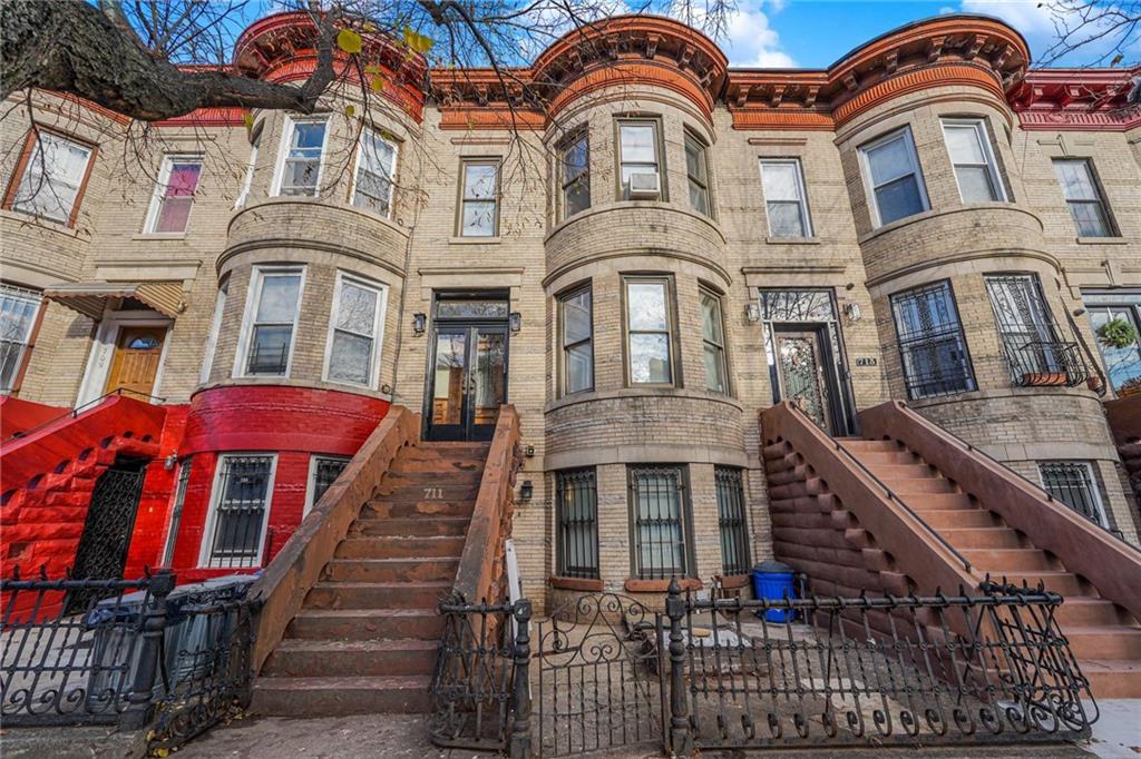 711 Macdonough St, Brooklyn, NY 11233 - multi unit property featuring stairway and a fenced front yard