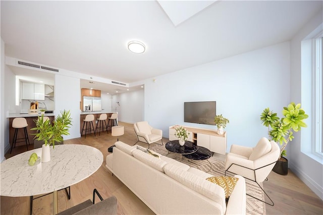 1722 84th St Unit 203, Brooklyn, NY 11214 - living room with light wood-type flooring and baseboards