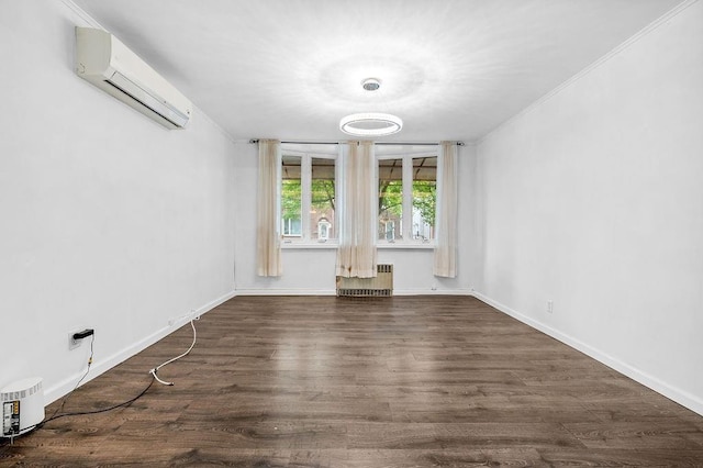 spare room with crown molding, a wall mounted air conditioner, dark wood-type flooring, and radiator heating unit