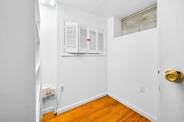 spare room with wood-type flooring