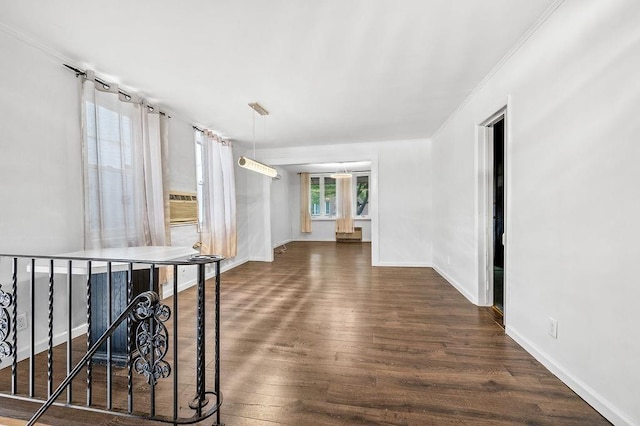 hallway with crown molding and dark hardwood / wood-style flooring