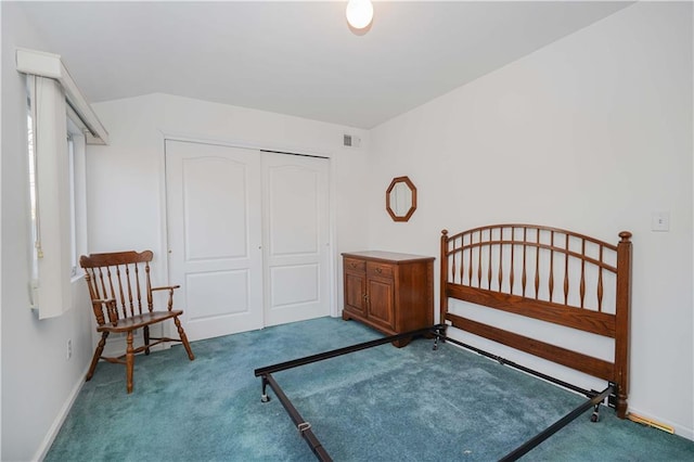 unfurnished bedroom with light carpet and a closet