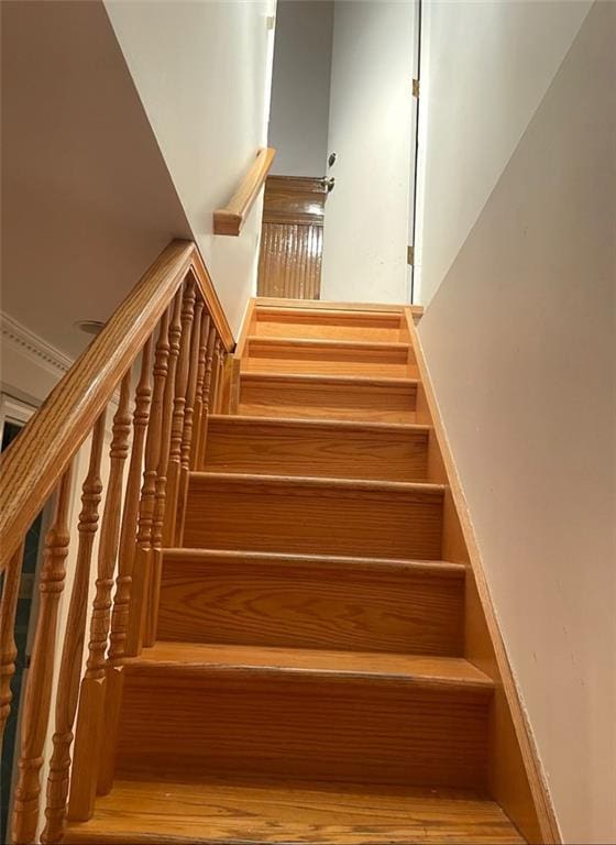 stairs with wood finished floors