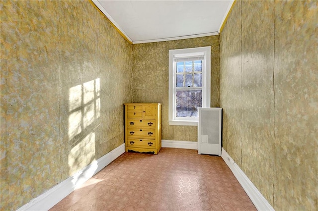 unfurnished room with ornamental molding