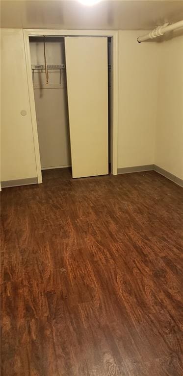 unfurnished bedroom featuring dark hardwood / wood-style flooring