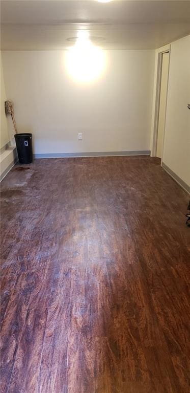 unfurnished room with dark hardwood / wood-style floors