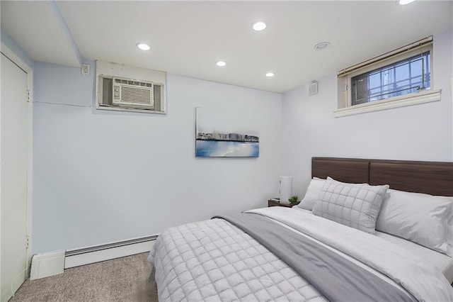 carpeted bedroom with recessed lighting, a wall unit AC, and a baseboard heating unit