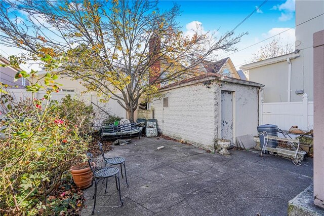 view of patio with a shed