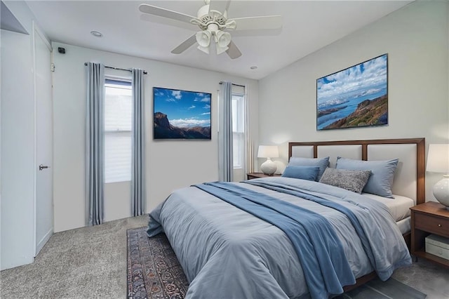 bedroom with ceiling fan and carpet flooring