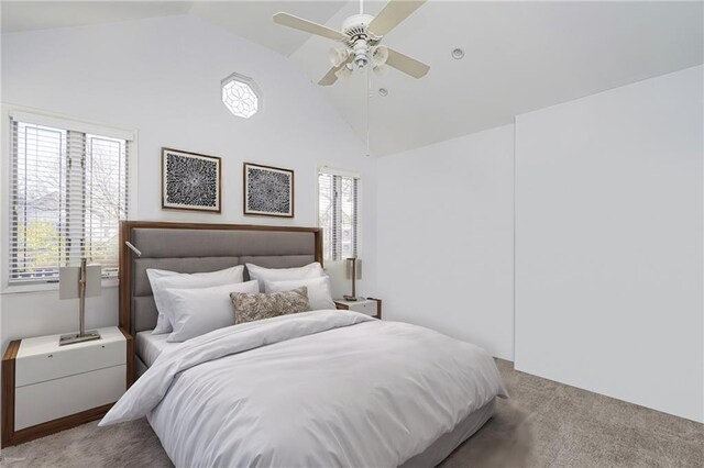 bedroom featuring light carpet, high vaulted ceiling, and ceiling fan